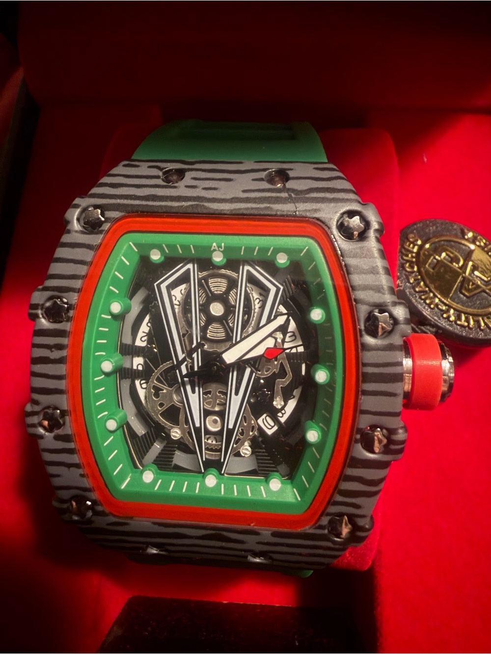 Invicta Green Dial Watch with Red Accents
